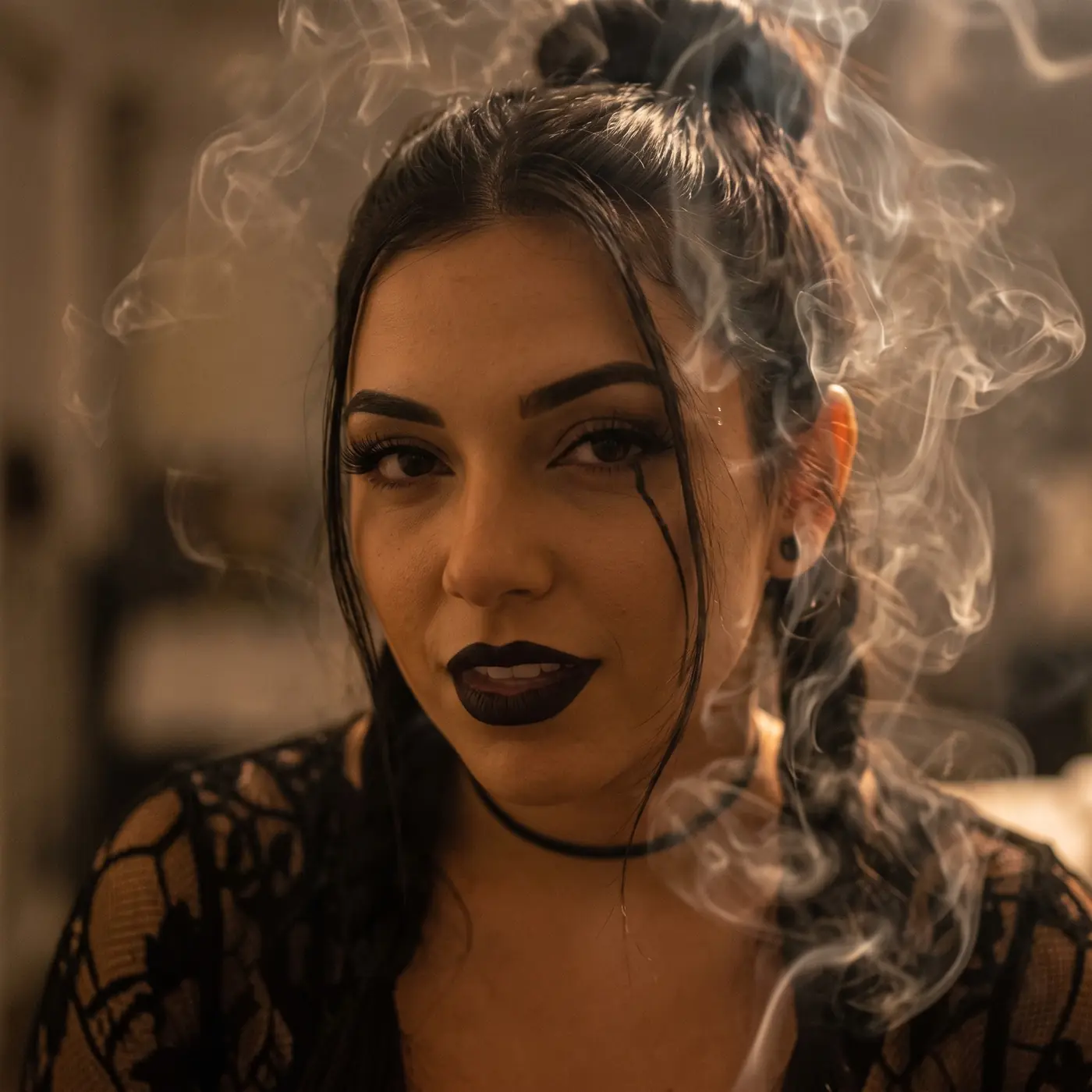 Atmospheric portrait of Kira surrounded by smoke